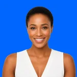 Career Coach, Grace Bailey, professional bio profile photo, Grace is a 35 year old African American woman wearing a white, sleeveless shirt, with a v-neck. She has a very short, tight haircut, and a big smile. She sits in front of a bright blue background.